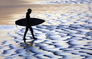 Shoreline surfer silhouette