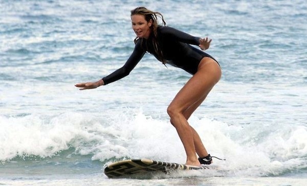 Elle Macpherson surfing