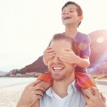 father and son at beach