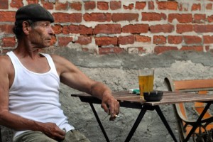 man in wife beater vest