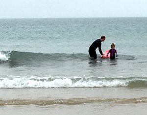 surferdad and daughter small waves