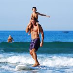 father and son surfing