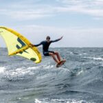 Surfer using a surf wing by F-one kites large