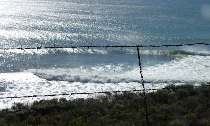 Barbed wire and waves - credit Dave Natal